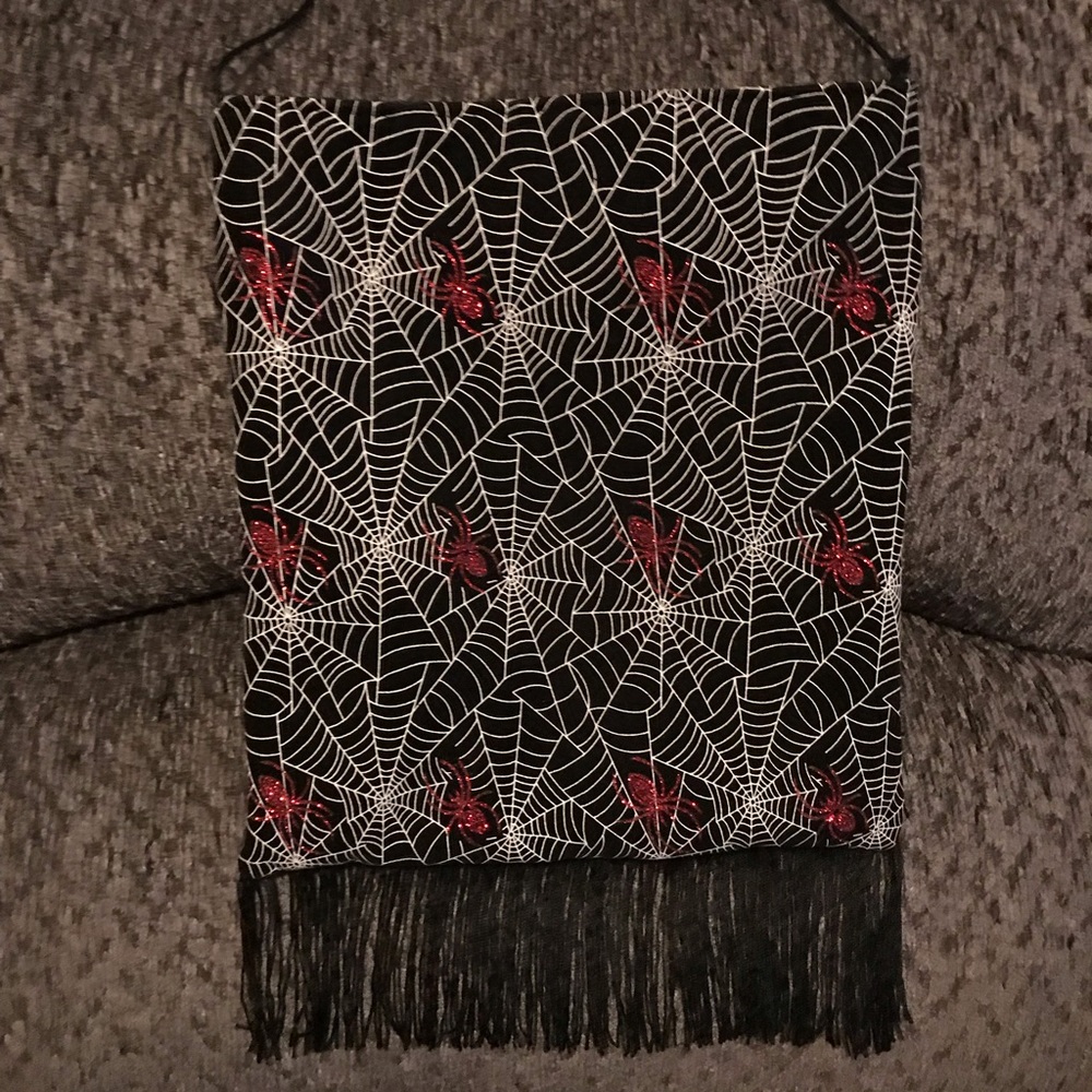 Black homemade fringe bag with red glitter spiders
